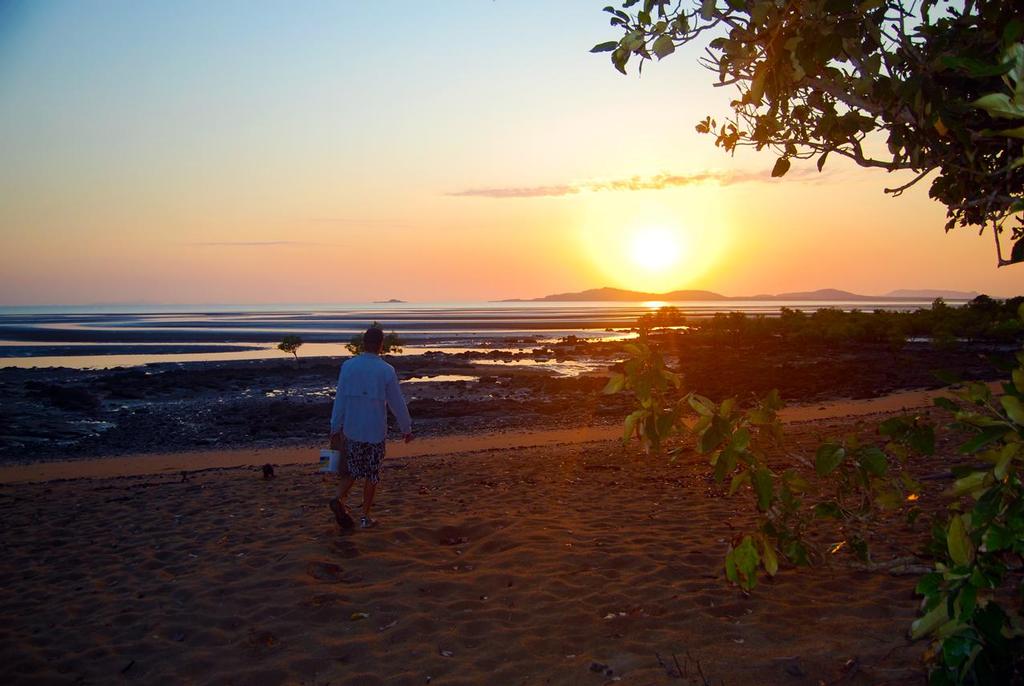 The author walking on St Helens Beach at low tide.  Heading out to cast the net for some prawns. © Lee Brake